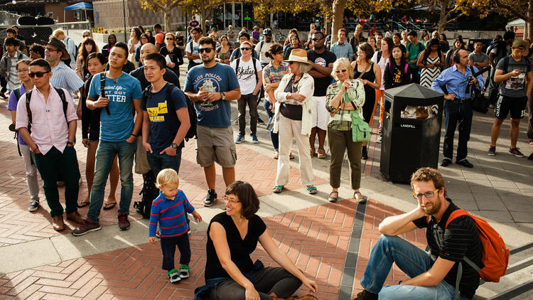 People gather at an event honoring the 50th anniversary of the Free Speech Movement at Sproul Plaza on the University of California, Berkeley campus